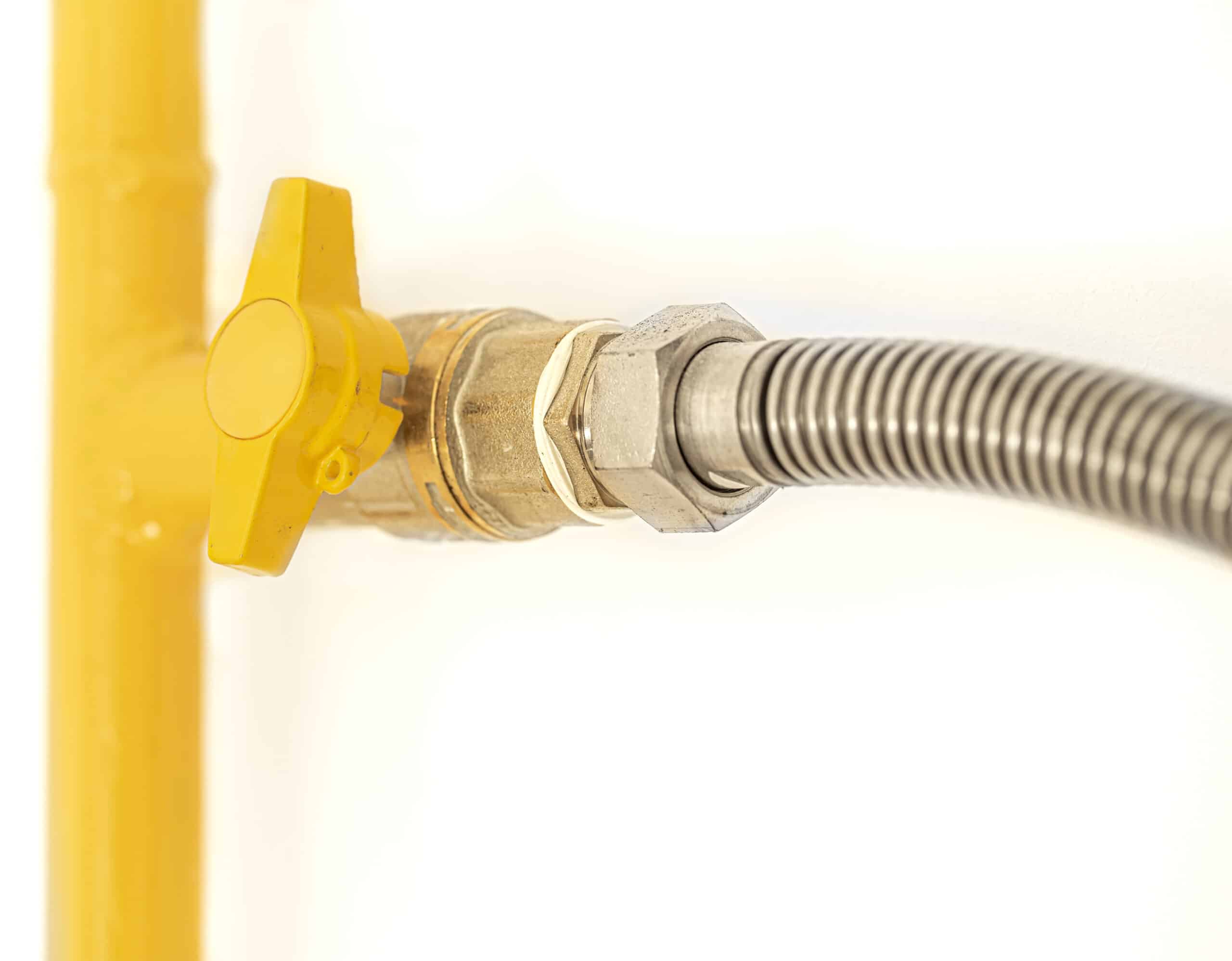 Yellow gas pipe with a valve