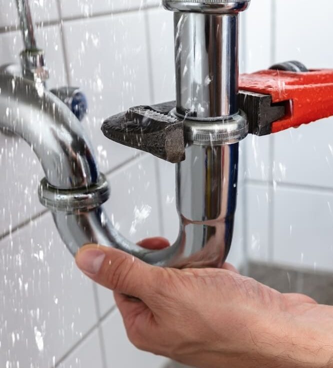 PlumberRepairingPipeWaterLeakFixingPlumbing